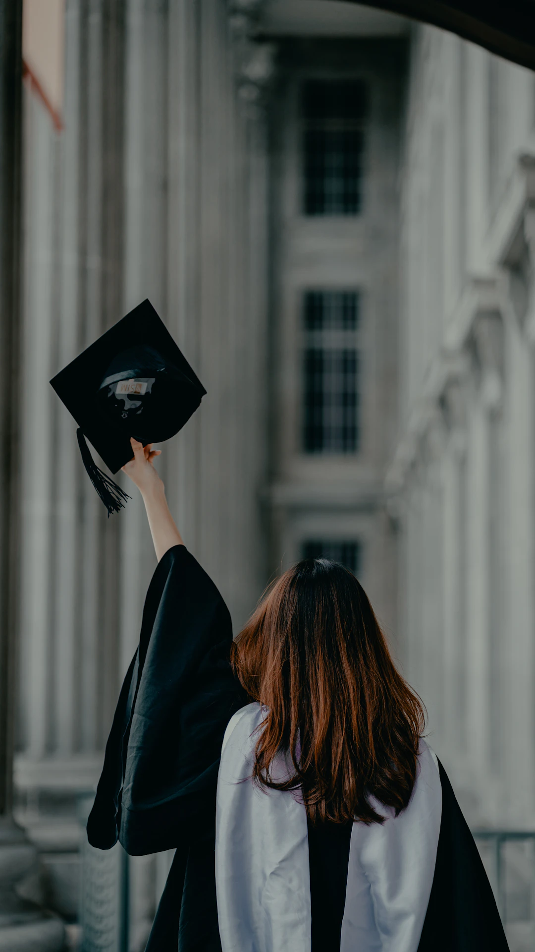 a woman in a graduation cap and gown