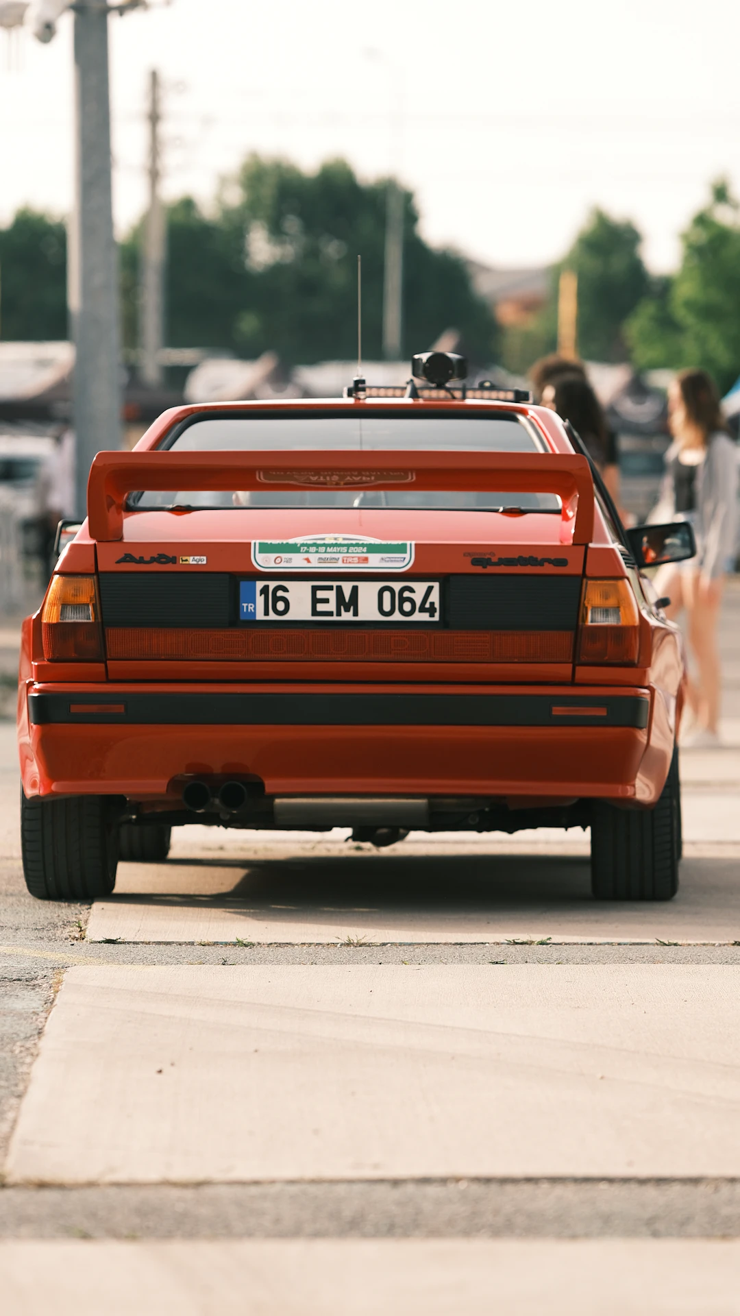 a red car parked on the side of the road