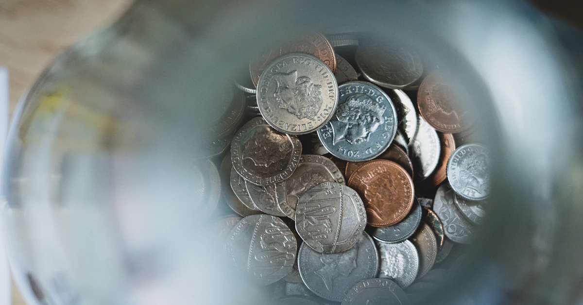 silver round coins on blue round container